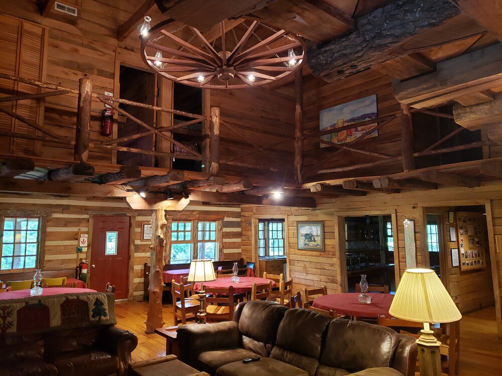 Sofas, tables and a wagon-wheel chandelier in the Main Lodge lounge