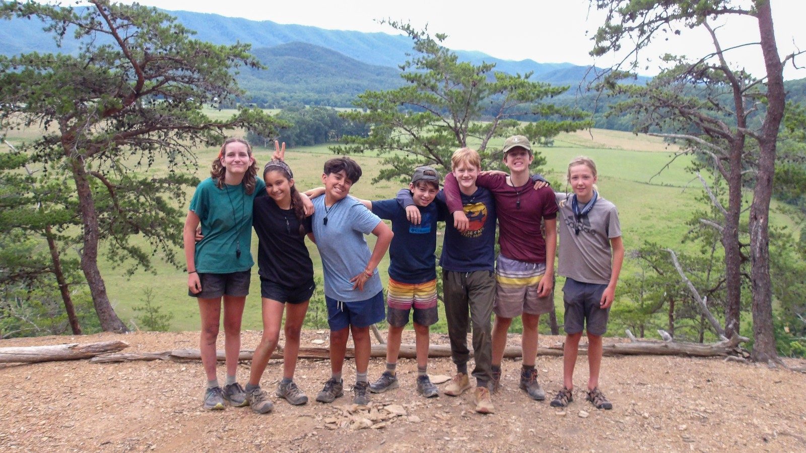 A group of campers together on a mountain overlook in the Blue Ridge