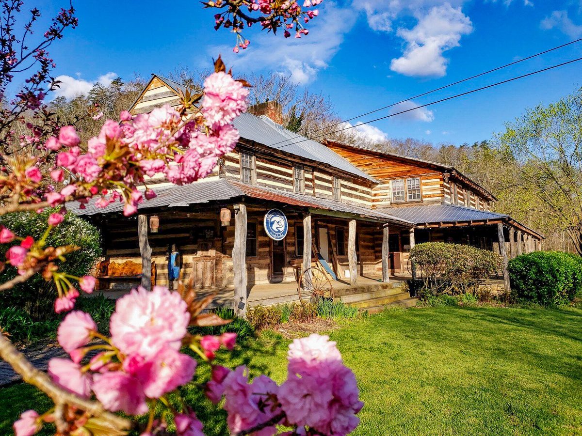 The Main Lodge porch in spring with blossoms in front