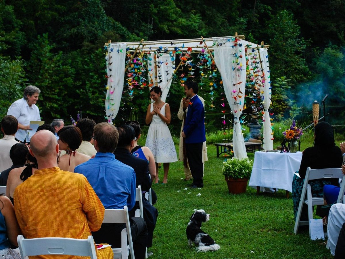 Wedding guests gathered for an outdoor ceremony at Wilderness Adventure
