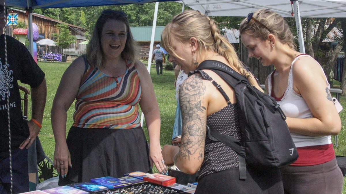Browsing handmade goods at the Yoga Venture vendor village
